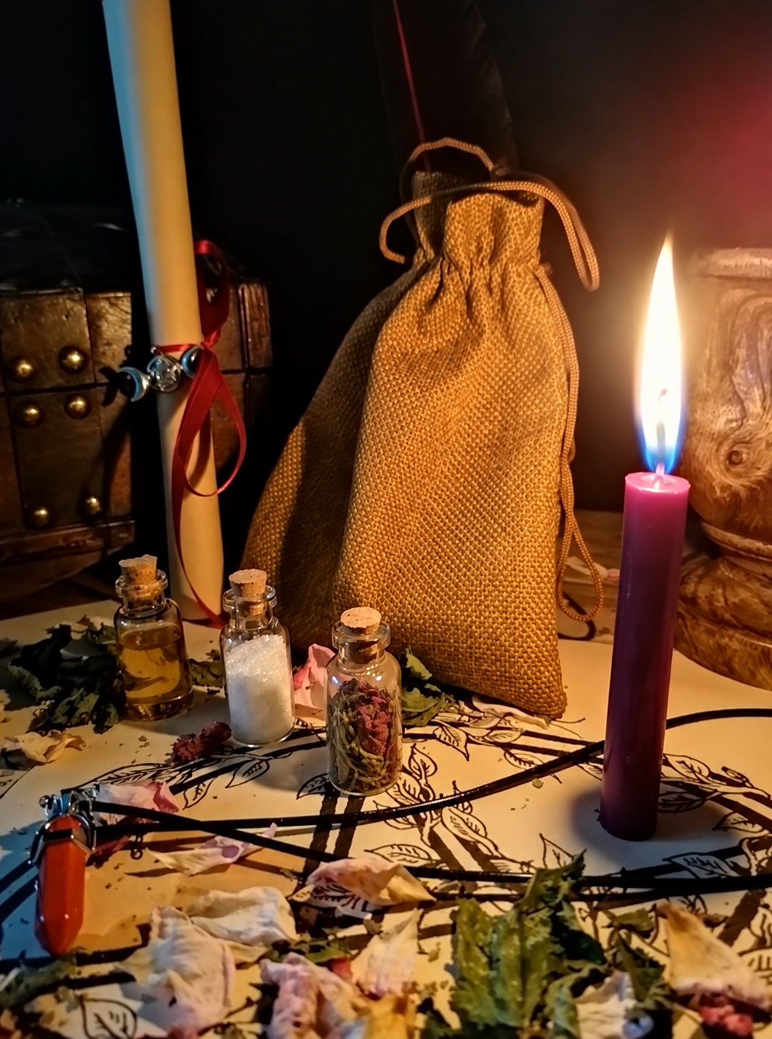 Illustrative scene for Powerful Custom Spell with a candle, dried plants and small glass vials, adapted from the shared ritual setting.